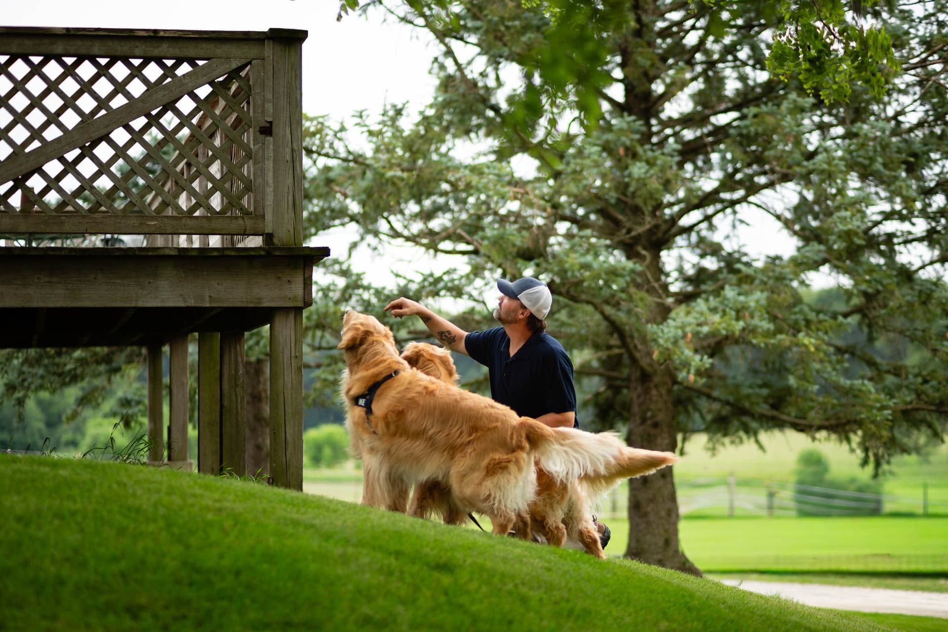 Mike Lacheta with his two golden retrievers, the namesake of Retriever Home Inspection